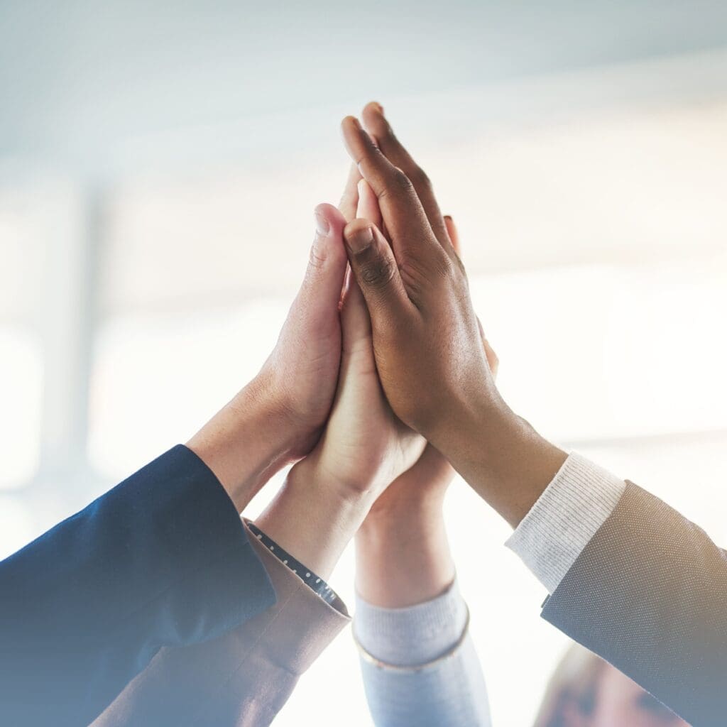 High five, businesspeople and their hands together for cooperation