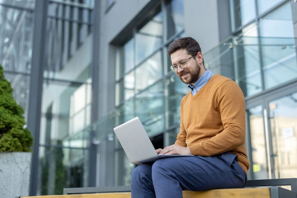 A man using his laptop.